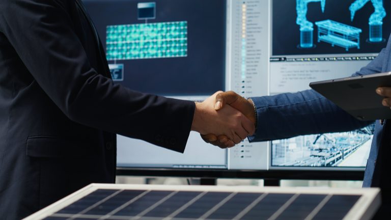Contracts as Intelligent Assets: Enabling Data-Driven Enterprises with AI 1 factory manager shakes hands with investor working expand production 1